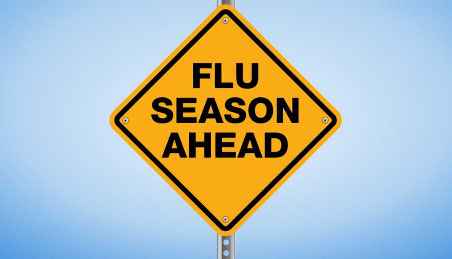 A yellow warning sign that says 'Flu Season Ahead'