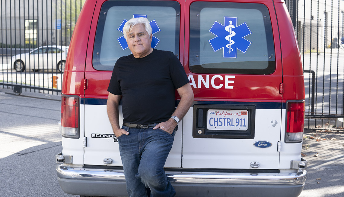 Comedian Jay Leno in front of an ambulance