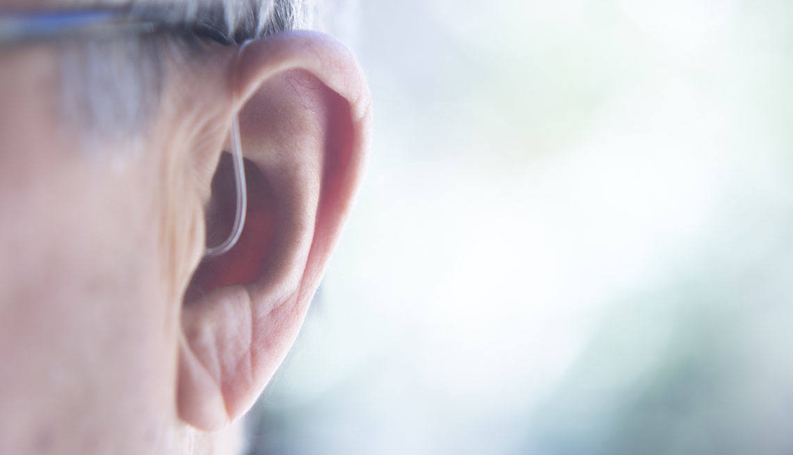 Closeup of Hearing Aid in Man's Ear