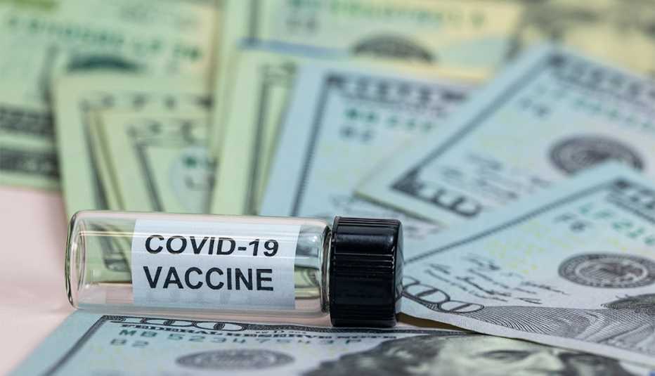 Coronavirus Covid-19 Vaccine bottle with US money