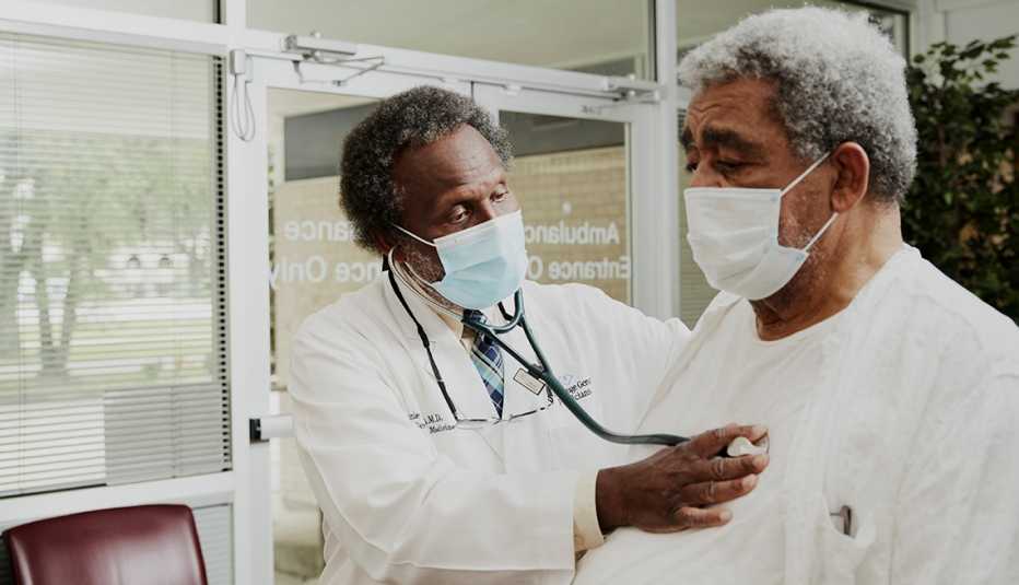 doctor batie examining a patient
