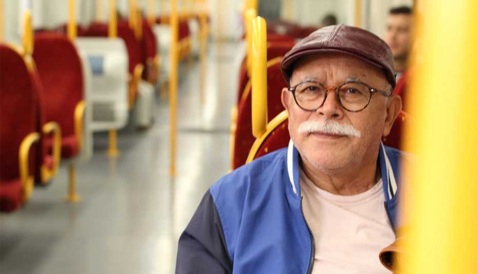 Senior man using public transportation.
