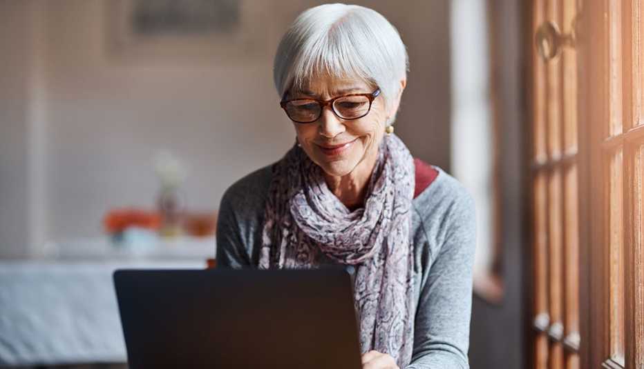woman using a laptop in a retirement home