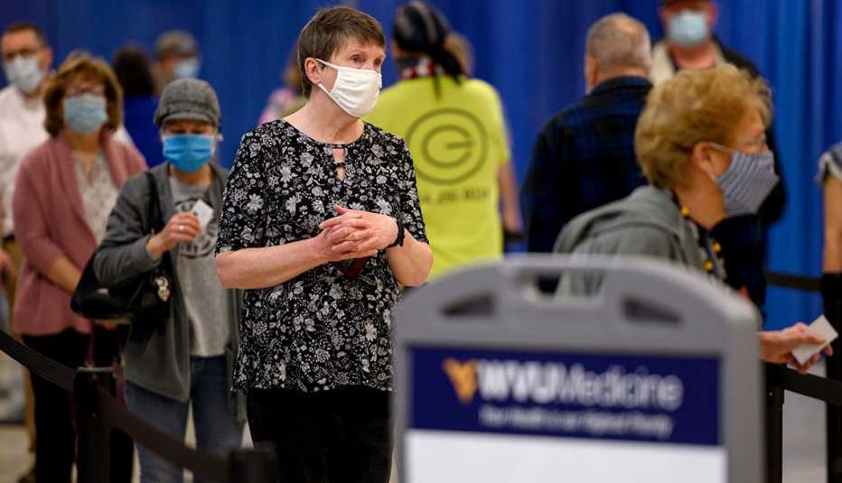 Residents wear protective masks while waiting to be vaccinated at a West Virginia United Health System Covid-19 vaccine clinic 