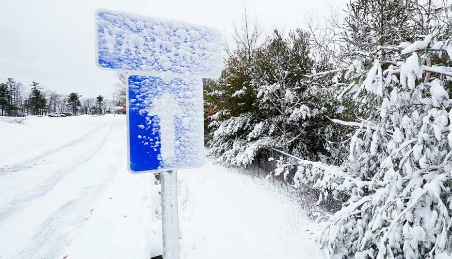 snow covered vaccines sign