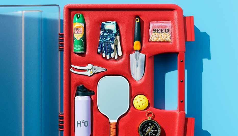 riff on a first aid kit containing bug spray a water bottle gardening gloves seeds and a digging spade a compass and a pickleball paddle and ball