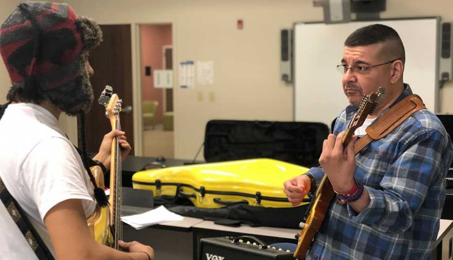Stroke survivor Gabe Vigil practices a guitar solo for an upcoming performance with his stroke survivor choir in Northern Virginia.  