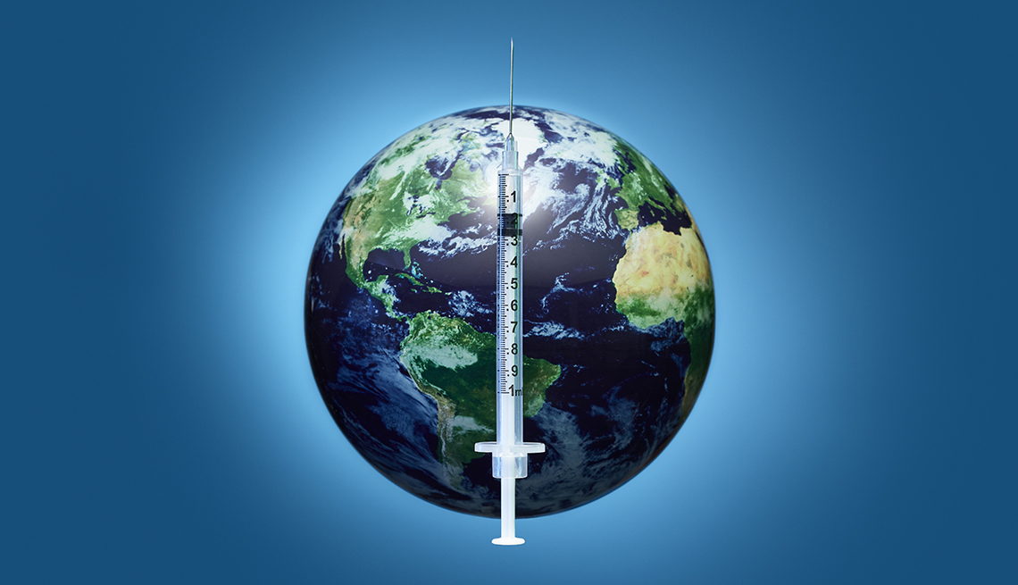 a hypodermic needle like the ones that give vaccines superimposed over an image of the earth