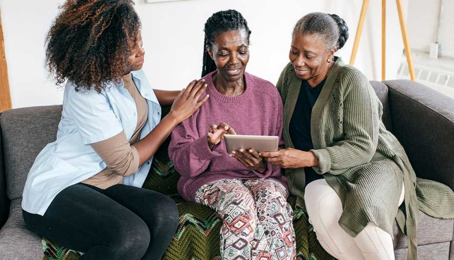 caregiver and senior women with tablet