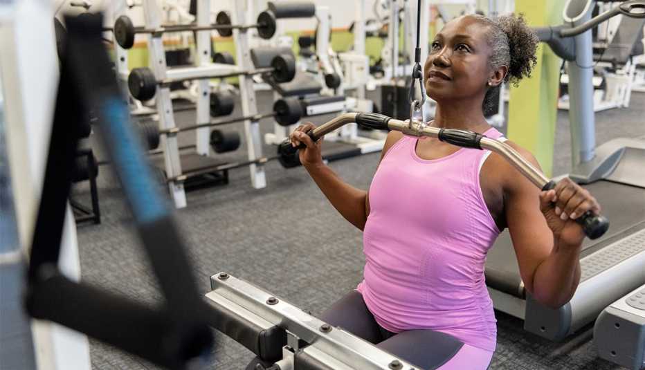 Older African American woman doing weight training