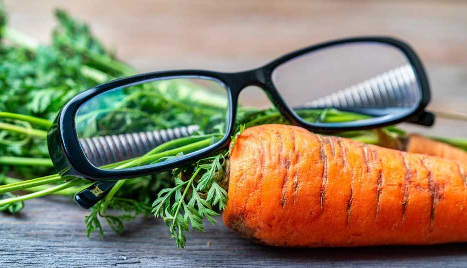 a pair of glasses on a pair of carrots