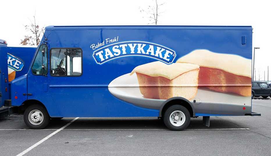 a blue tastykake truck with the logo and a photo of one of its products painted on it