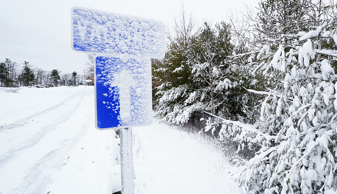 snow covered vaccines sign