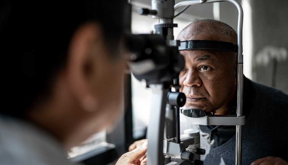 ophthalmologist examining patient's eyes