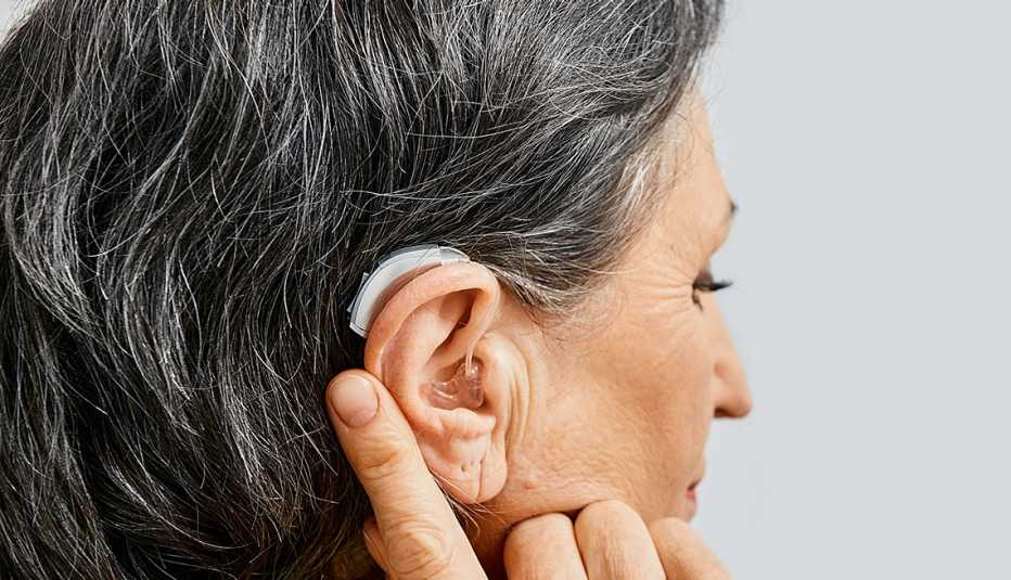 hearing aid behind the ear of a woman, close-up