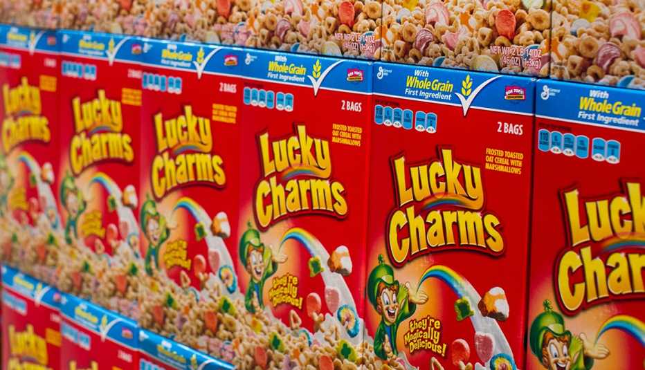 store shelf full of boxes of lucky charms cereal