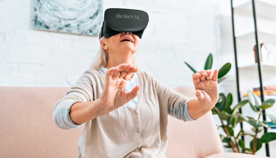woman wearing a virtual reality headset holding her hands out in front of her body