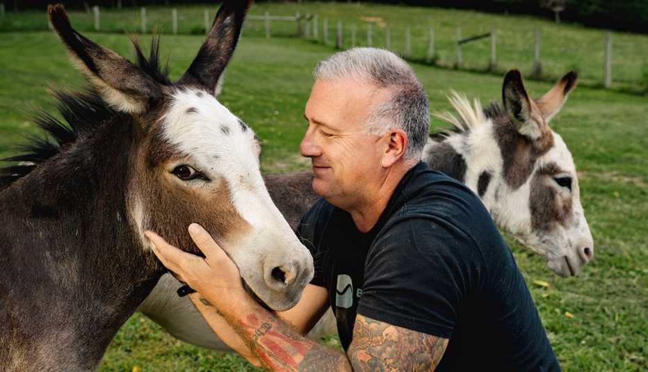 heath haug with two of his miniature donkeys