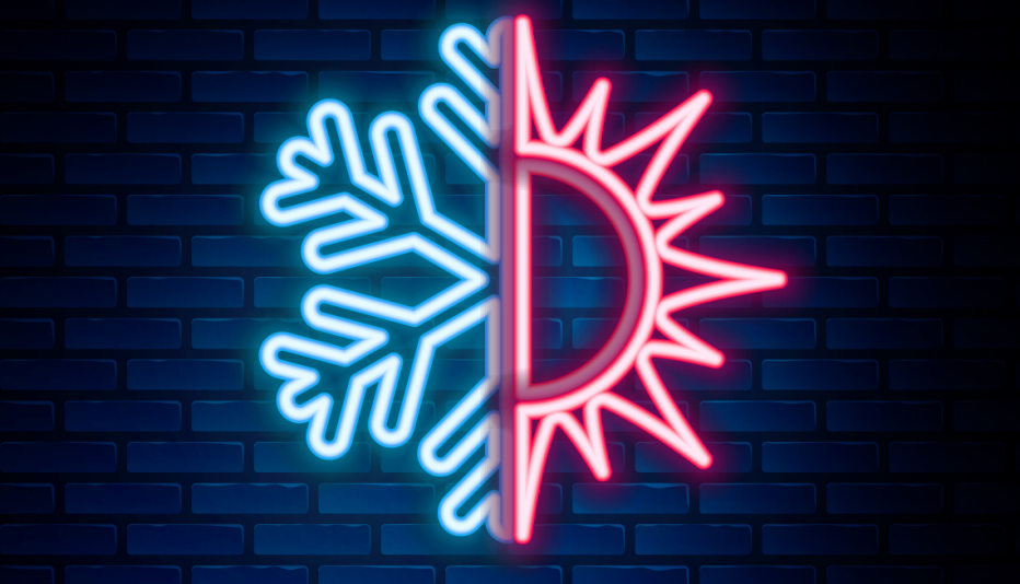 sun and snowflake icon on brick wall background