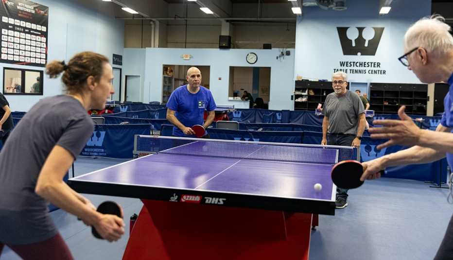 Nenad Bach, far right, founded PingPongParkinson and enjoys playing with members of all ages. In addition to play, the group does stretches, low-impact exercises, juggling exercises and facial movement techniques.