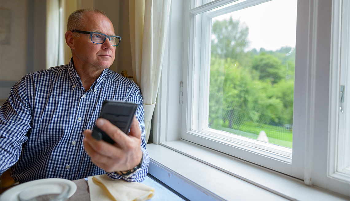 Man looking out window, Early Retirement