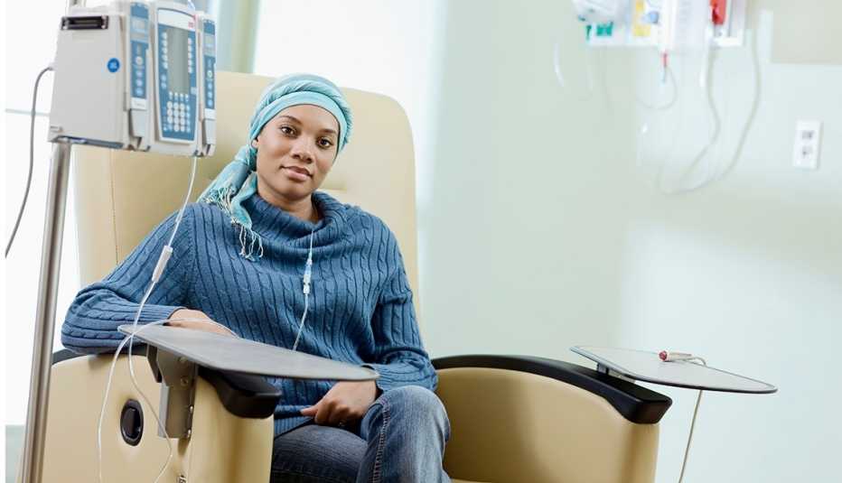woman in scarf receiving chemo
