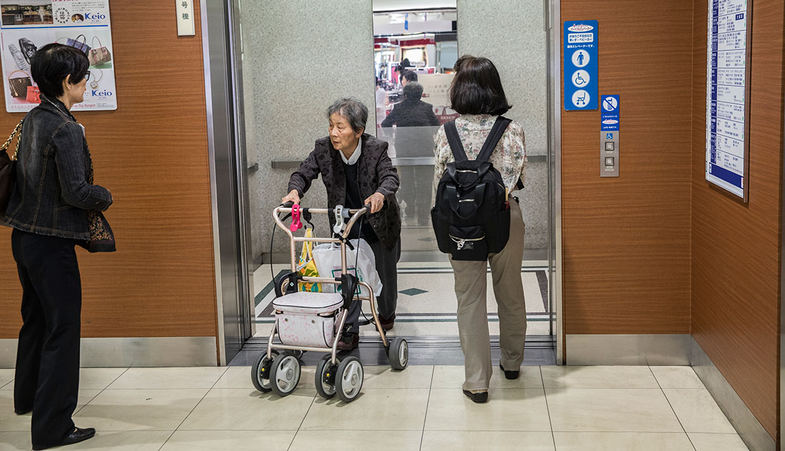 Elevators reserved for seniors, wheelchair users, and silver cars at department store in Tokyo, Japan.
