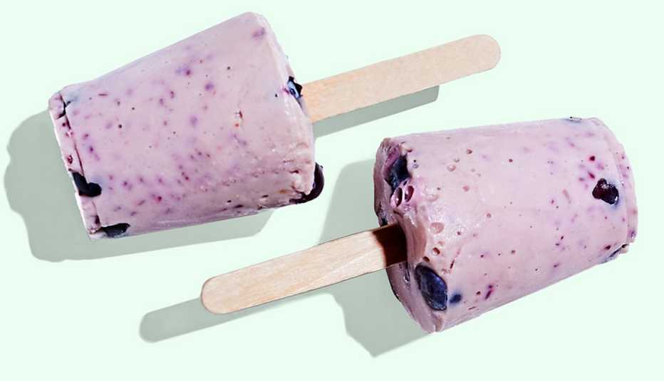 A pair of blueberry-banana yogurt pops