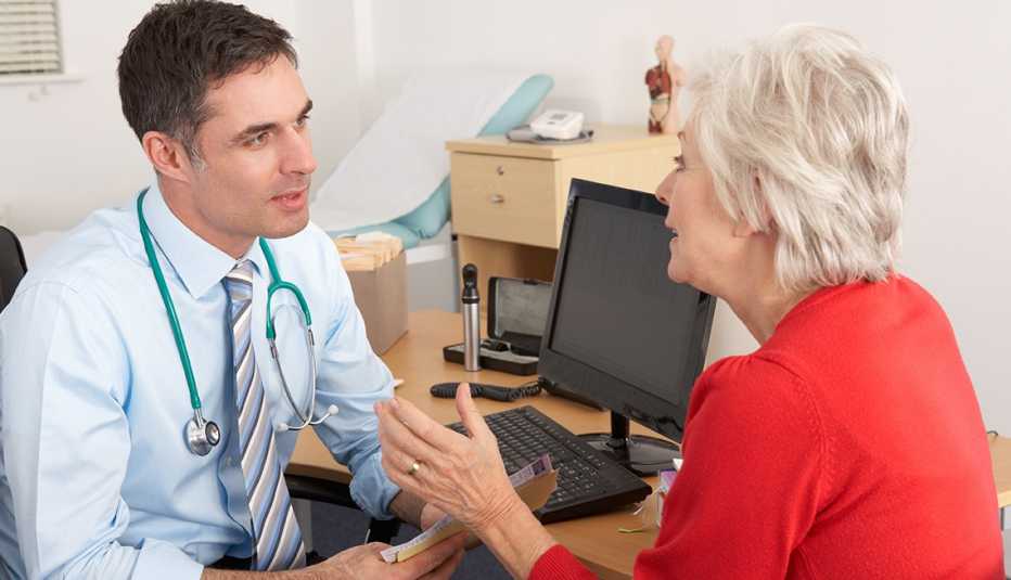 older female patient talks with doctor during a a Medicare wellness visit