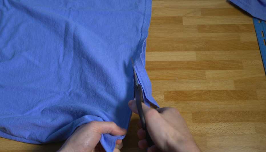 Cutting a strip from the bottom of a cotton t-shirt