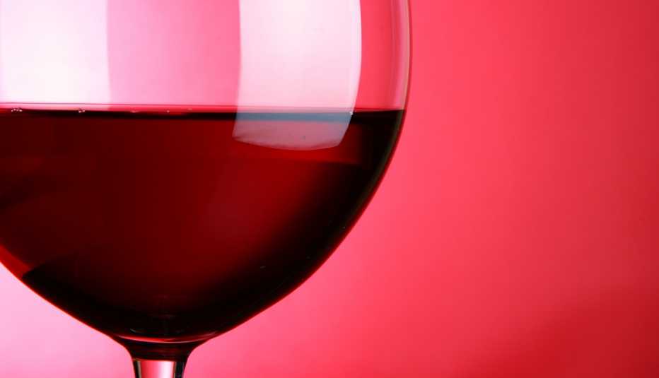 close up of a large wine glass filled with red wine