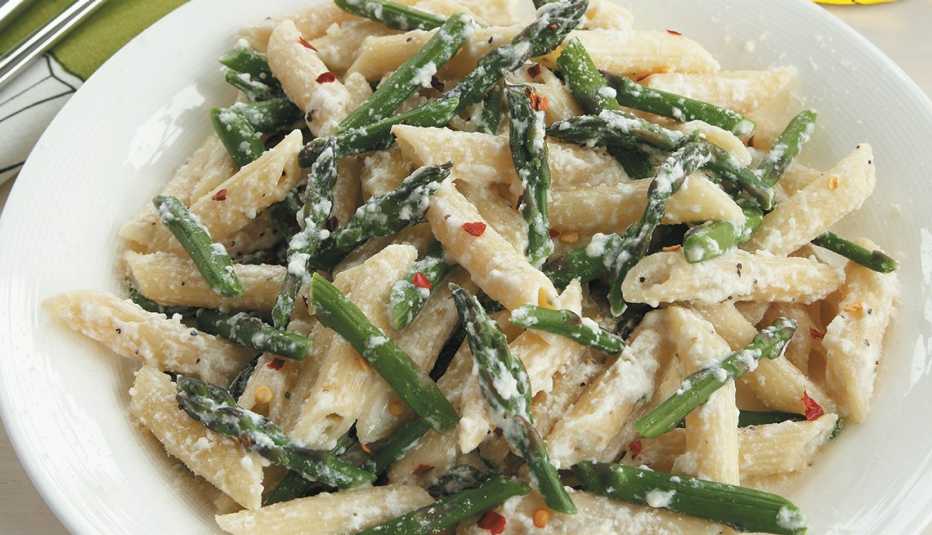 cooked dish of penne, ricotta and asparagus