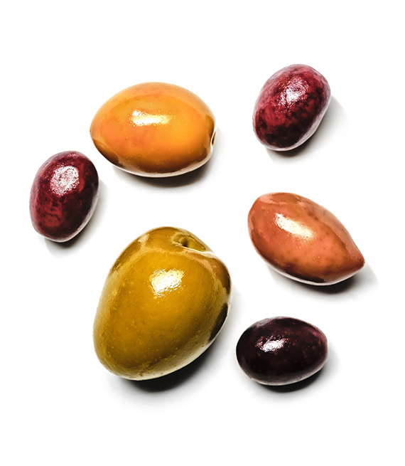 several different kinds of olives are shown on a white backgrounf