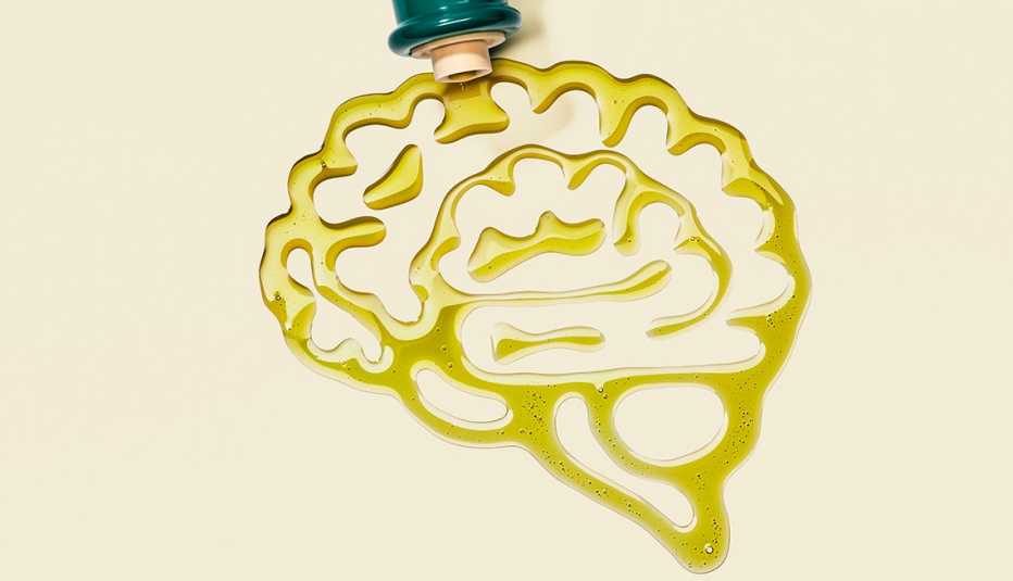 olive oil poured out of a bottle in the shape of a brain
