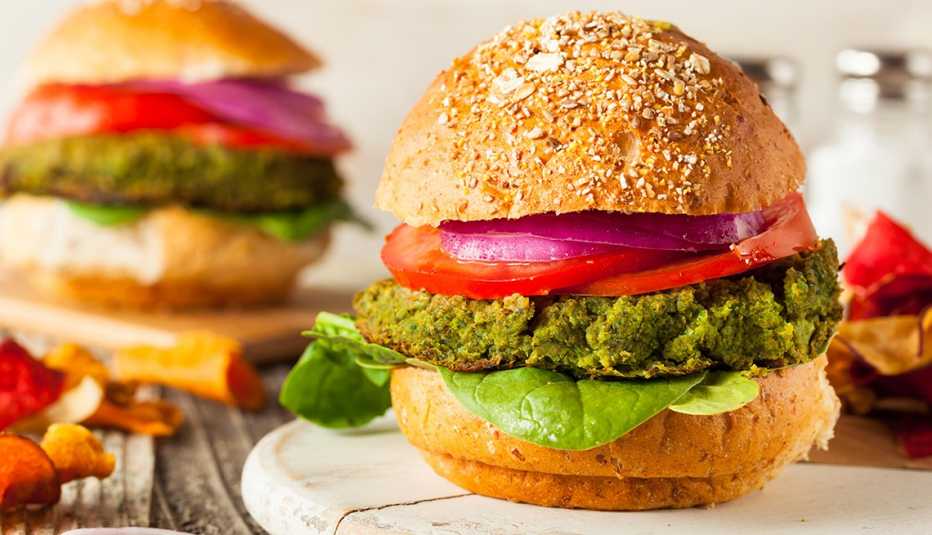 green vegan burgers with lettuce and tomato