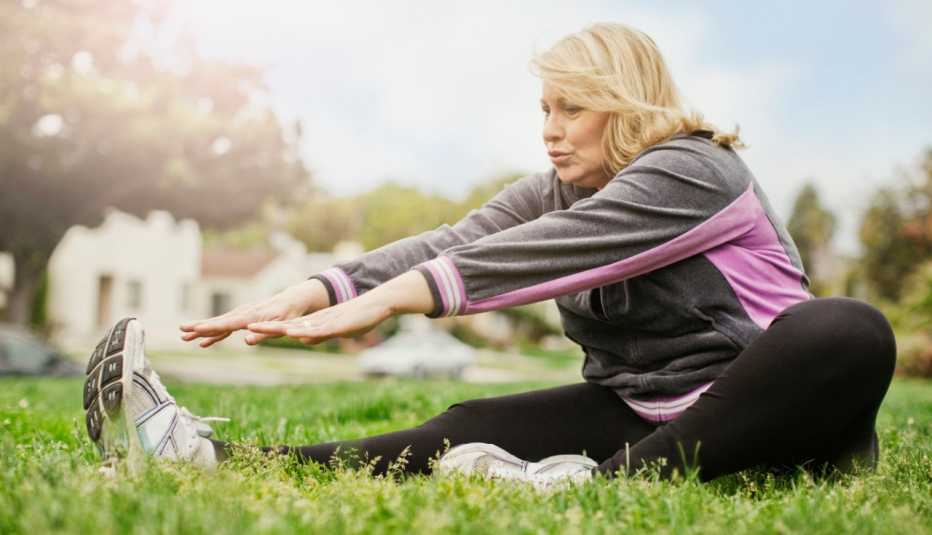 woman stretching in the park