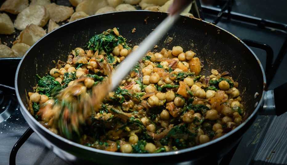 Curried chickpeas cooking on the stove