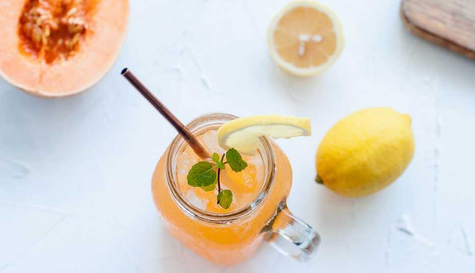 overhead image of a mocktail with citrus and melon