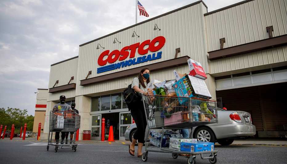 Shoppers wearing face masks leave a Costco wholesale store
