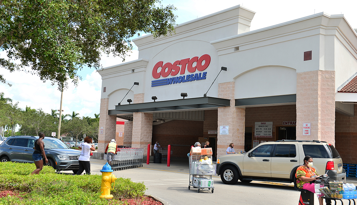 customers wearing face masks leaving a Costco Wholesale store in Pembroke Pines, Florida.