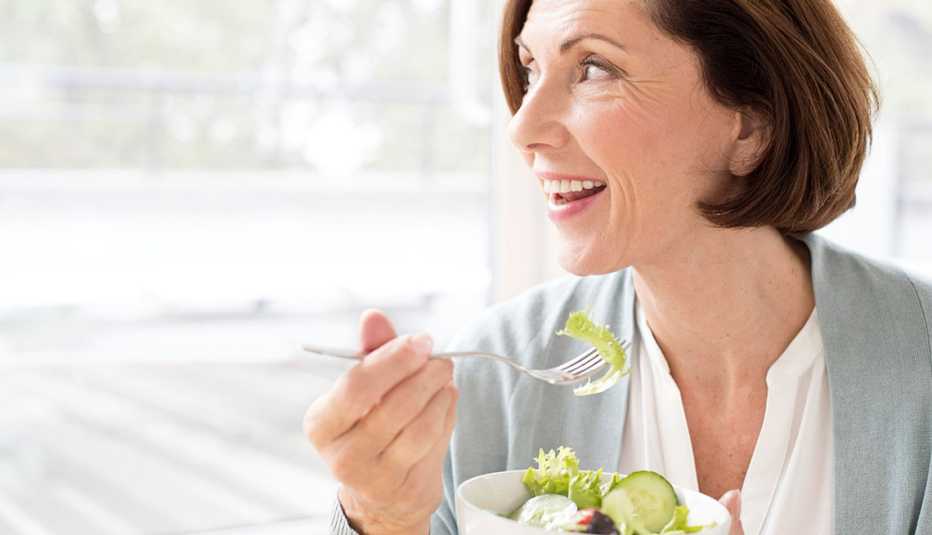 mature woman eating salad
