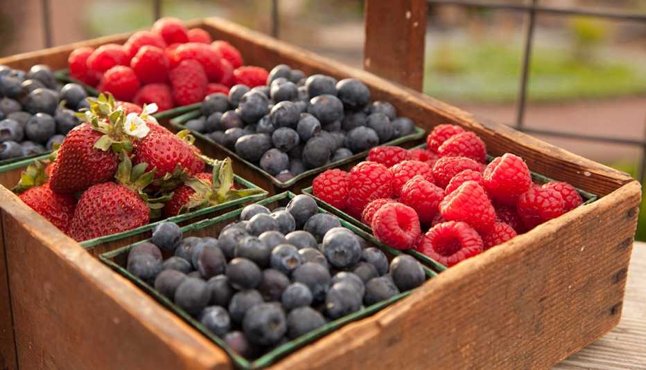 fresh berries sitting in a crate on a farm
