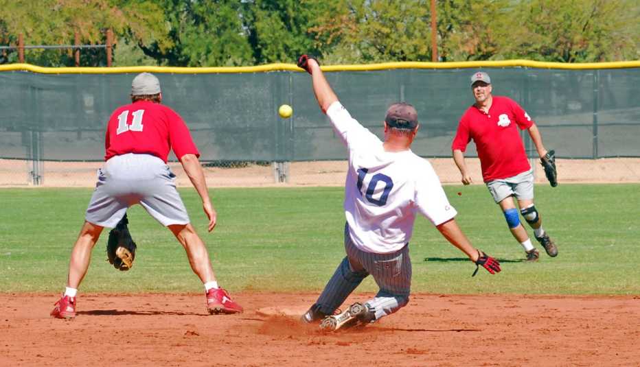 terry hennessy sliding into second base at a baseball championship game in phoenix arizona