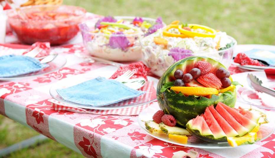 Picnic table of fruit and salads