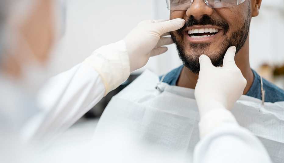 man having teeth looked at after a teeth whitening procedure