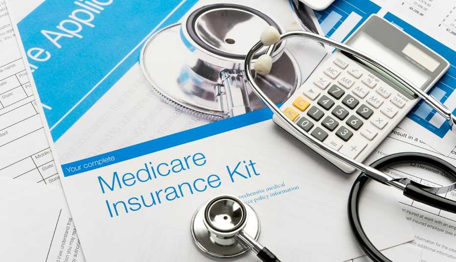 Medicare brochure with paperwork and a stethoscope..
