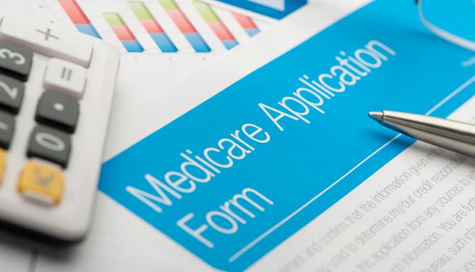 Medicare application form with paperwork