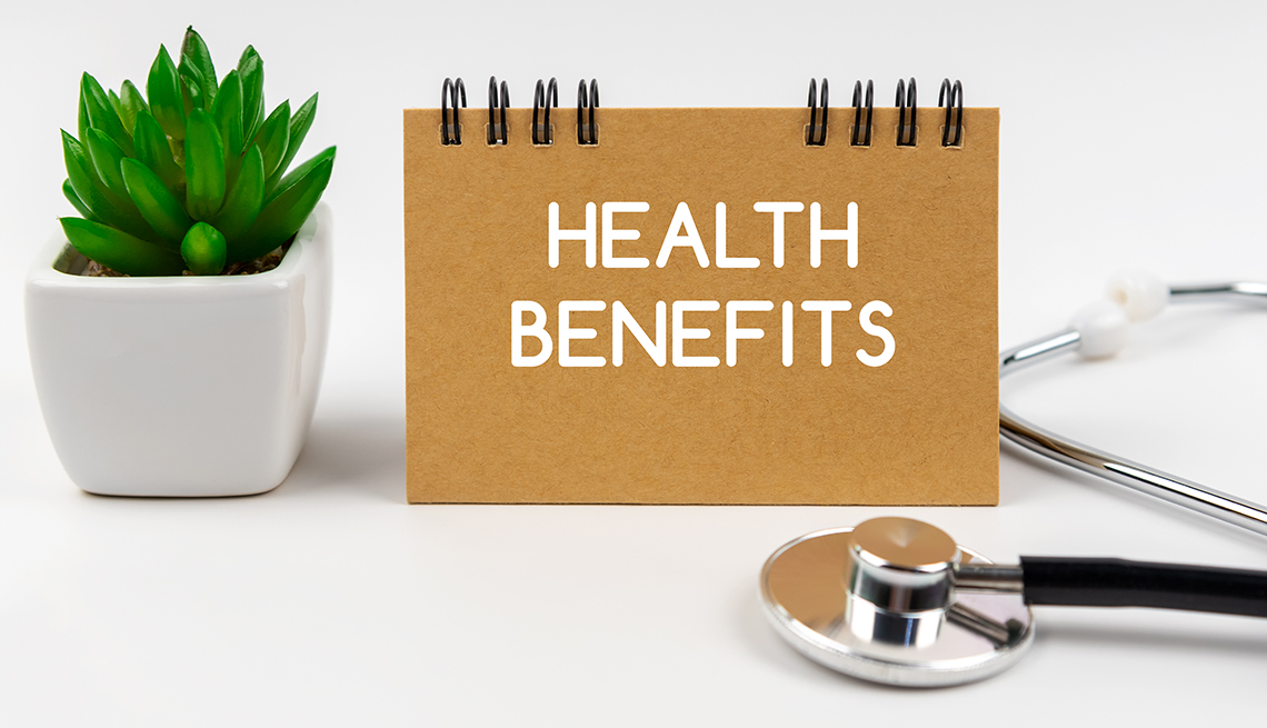 sign on a desk that says Health Benefits 