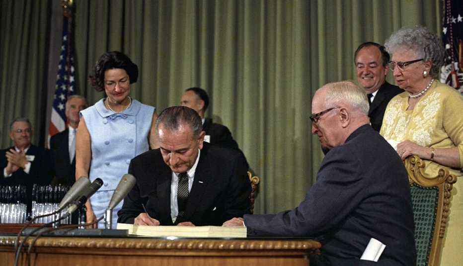 nineteen sixty five photo of president lyndon johnson signing medicare into law
