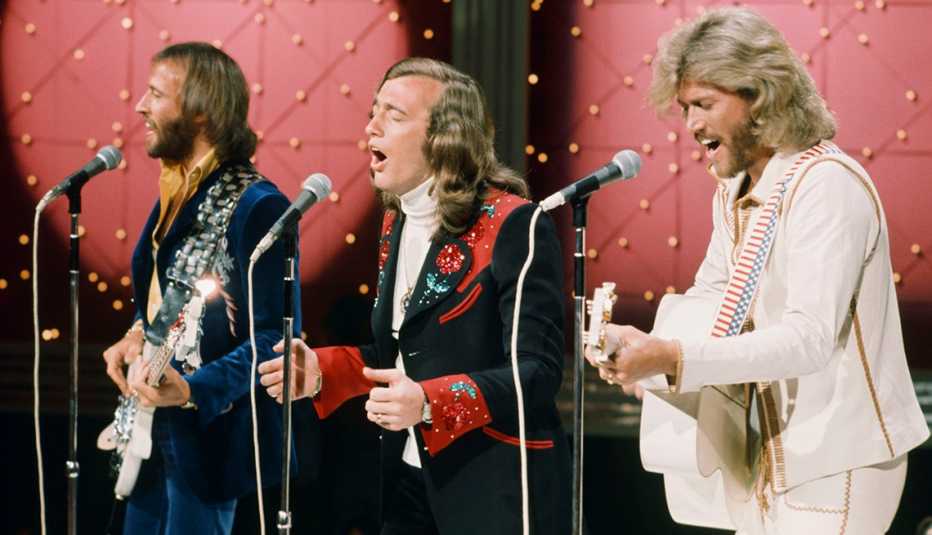 the bee gees perform on stage